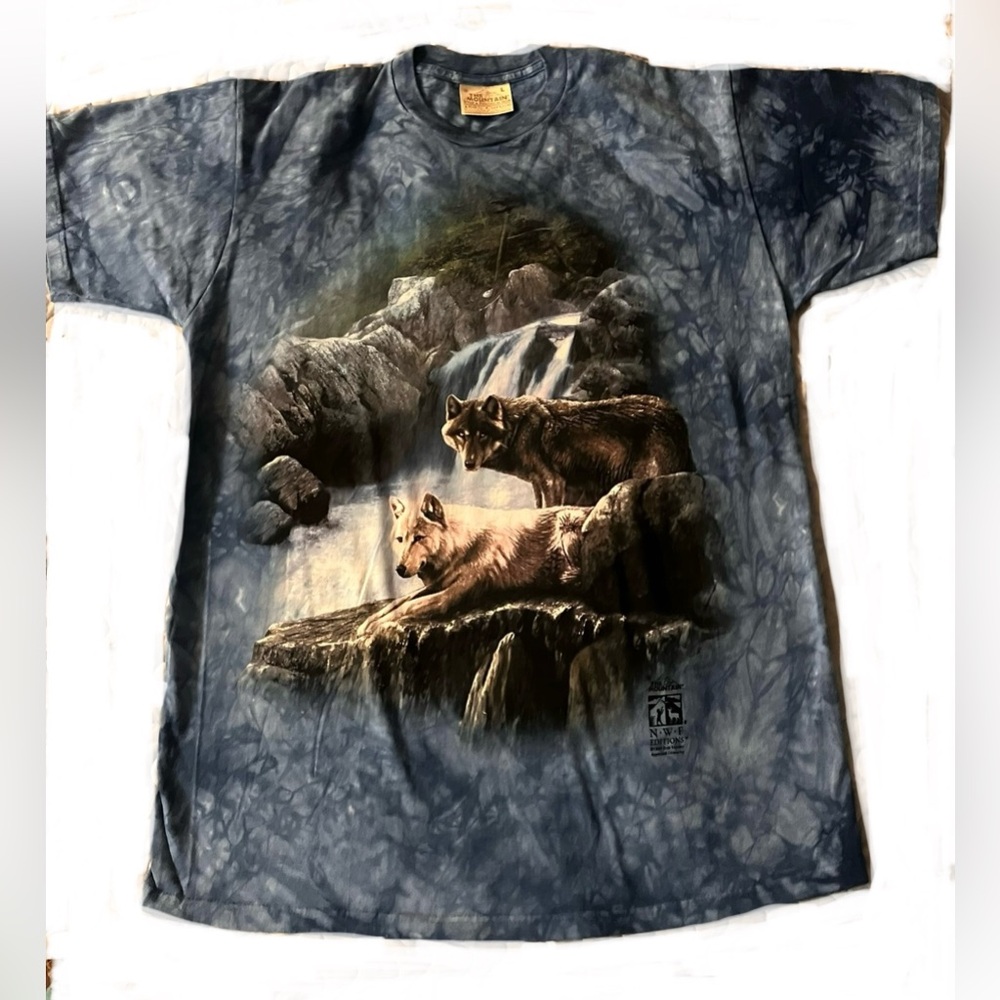 Large. Blue never worn wolf themed t-shirt.